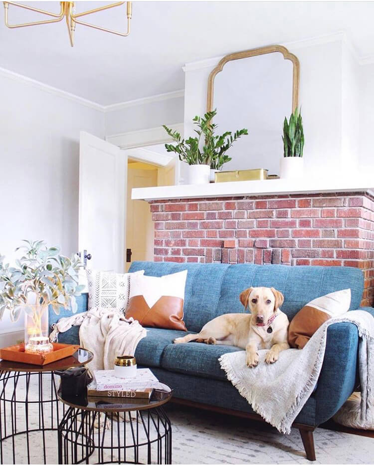 A colorful "sitting room" with unique tables and family members features Growing Candle Clara. @prettypennystyling